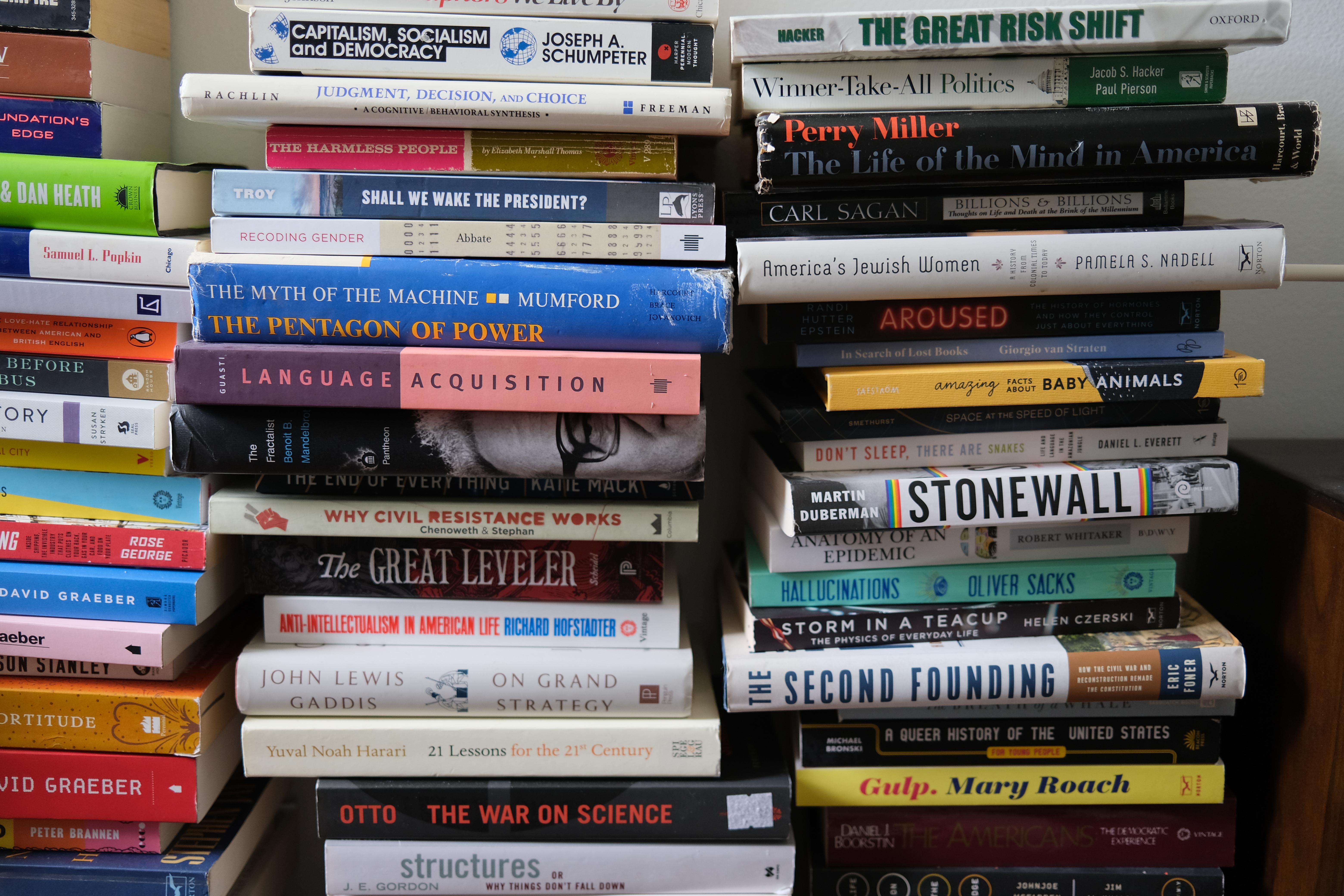 Photograph of three piles of books